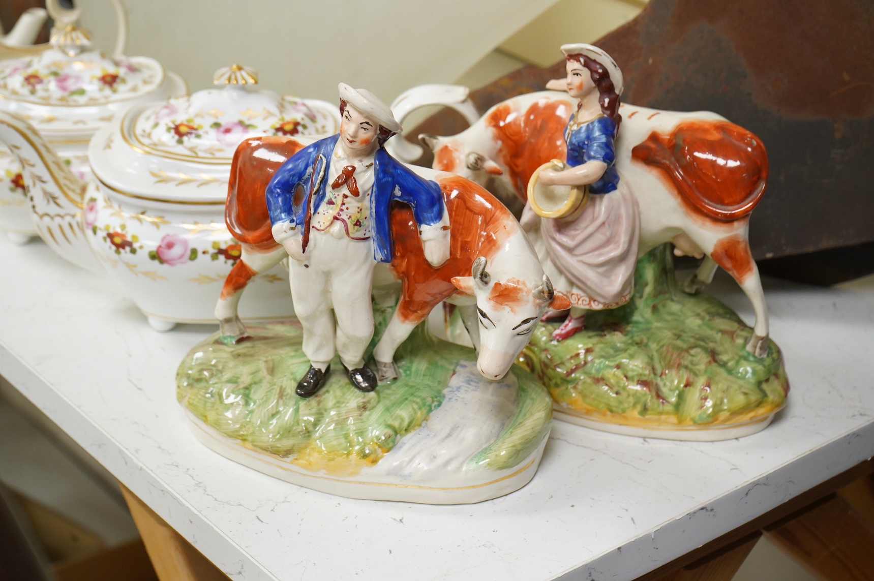 An early 19th century Derby three piece tea service, A pair of Staffordshire cow groups, Wedgwood etc